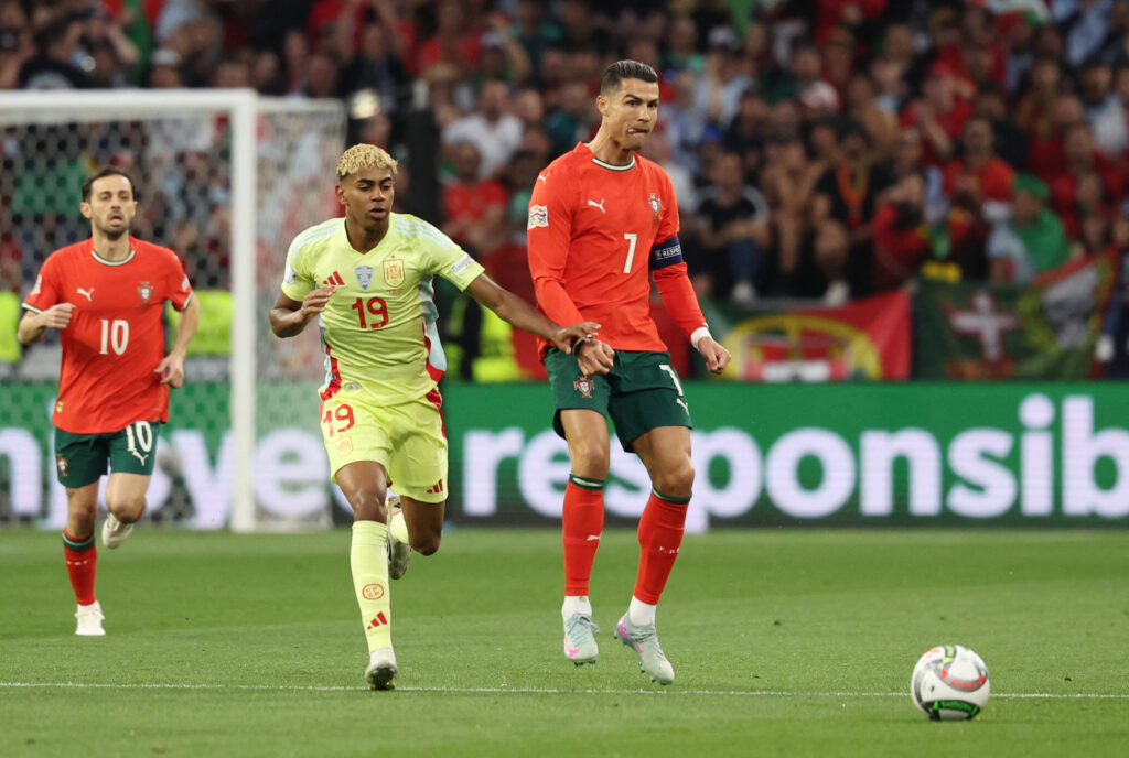 Lamine Yamal in action with Cristiano Ronaldo